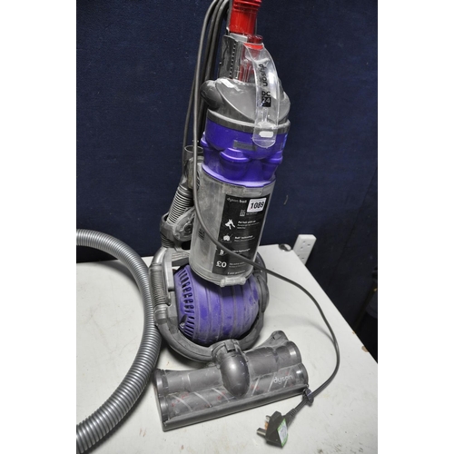 1089 - A DYSON DC24 ANIMAL BALL VACUUM CLEANER (brush bar not turning) and a Dyson DC49 Pull Along vacuum c... 