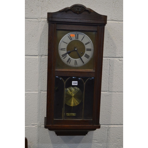 1198 - AN EARLY 20TH CENTURY OAK WALL CLOCK (winding key and pendulum), height 77cm together with an Edward... 