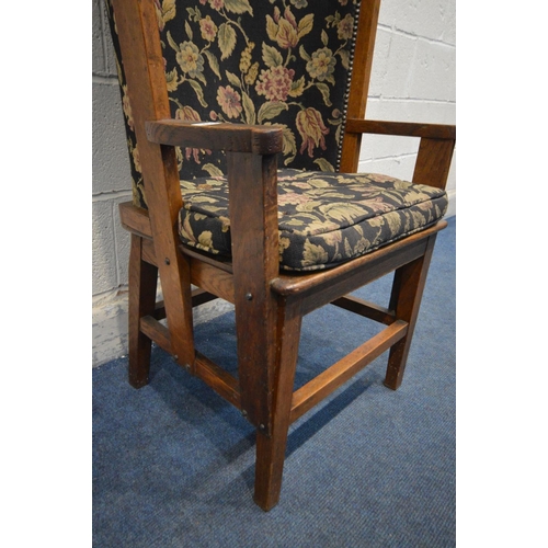 1202 - AN ARTS AND CRAFTS OAK ORKNEY CHAIR, black and florally upholstered back and matching removable cush... 