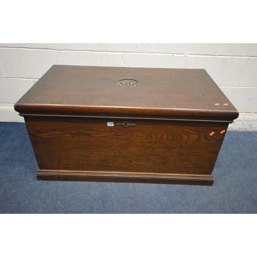 1207 - AN EARLY 20TH CENTURY OAK BLANKET CHEST, initialled 'AHH, 1904' to the lid, with twin brass handles,... 