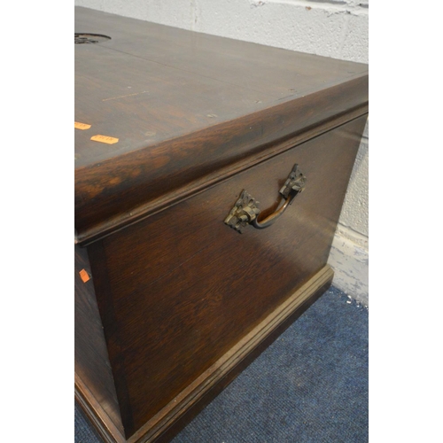 1207 - AN EARLY 20TH CENTURY OAK BLANKET CHEST, initialled 'AHH, 1904' to the lid, with twin brass handles,... 