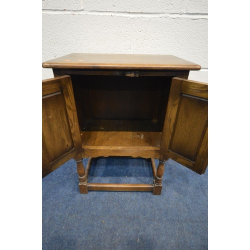 1210 - A SMALL OAK GOTHIC TWO DOOR CABINET, width 51cm x depth 33cm x height 68cm