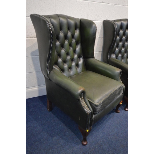 1213 - A FOUR PIECE GREEN LEATHER CHESTERFIELD SUITE, comprising a winged settee, width 170cm and a pair of... 