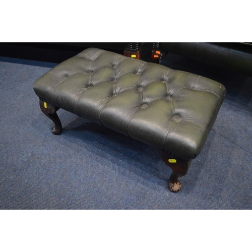 1213 - A FOUR PIECE GREEN LEATHER CHESTERFIELD SUITE, comprising a winged settee, width 170cm and a pair of... 