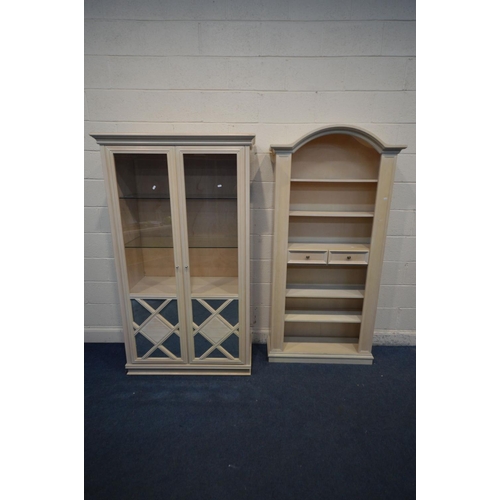 1219 - A BLEACHED WOOD TWO DOOR DISPLAY CABINET, with two glass shelves, width 107cm x depth 49cm x height ... 