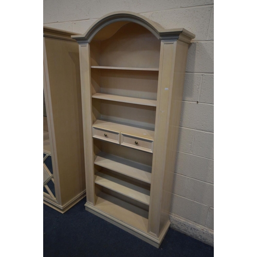 1219 - A BLEACHED WOOD TWO DOOR DISPLAY CABINET, with two glass shelves, width 107cm x depth 49cm x height ... 