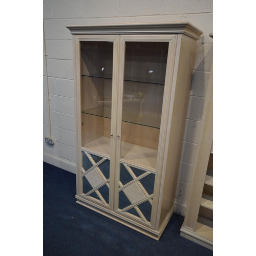 1219 - A BLEACHED WOOD TWO DOOR DISPLAY CABINET, with two glass shelves, width 107cm x depth 49cm x height ... 