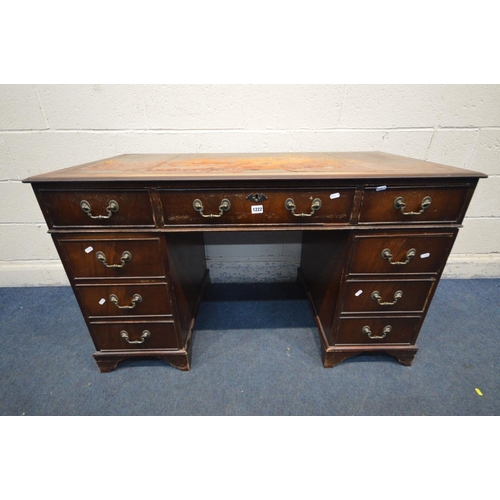 1222 - AN EARLY 20TH CENTURY MAHOGANY PEDESTAL DESK, with a triple leather tooled top with nine assorted dr... 