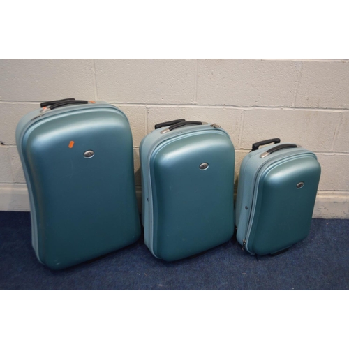 1421 - A SET OF THREE MINT GREEN GRADUATED SUITCASES