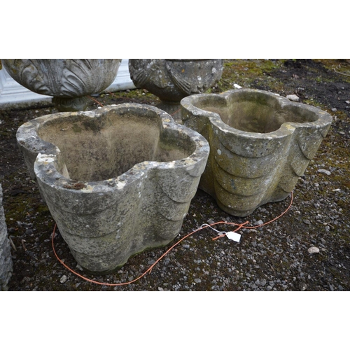 905 - A PAIR OF COMPOSITE CLOVER LEAF GARDEN PLANTERS, along with a pair of brick effect circular planters... 