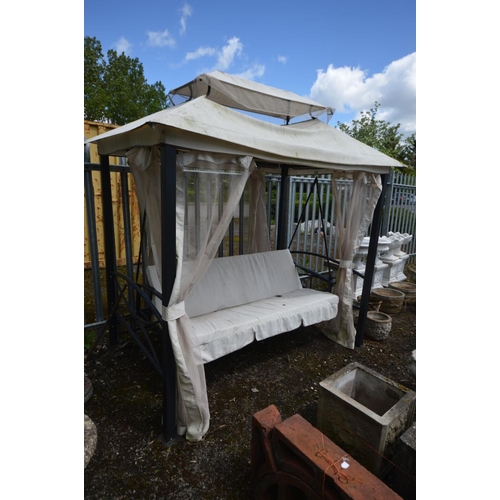 907 - A METAL GARDEN SWINGING SEAT, rectangular frame with canopy, drapes and 67inch bench with adjustable... 