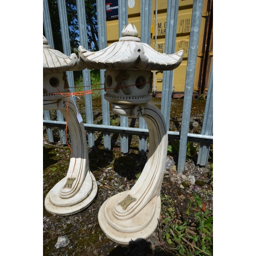 912 - A PAIR OF COMPOSITE GARDEN JAPANESE PAGODA LANTERNS, on a curved support, height 82cm