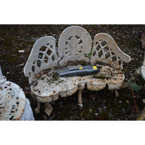 919 - A MINITRURE CAST IRON CURVED GARDEN BENCH, and two chairs (3)