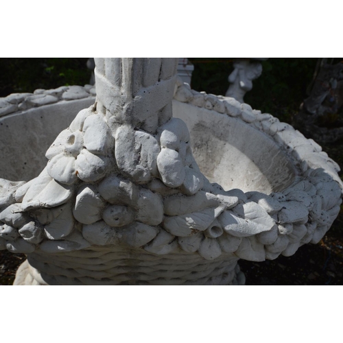 925 - A COMPOSITE GARDEN PLANTER of a woven fruit basket, with a single handle, length 78cm x depth 57cm x... 