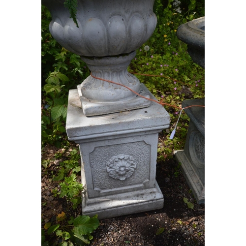 928 - A GREY COMPOSITE GARDEN URN, on a separate plinth, diameter 56cm x height 68cm x height of plinth 35... 