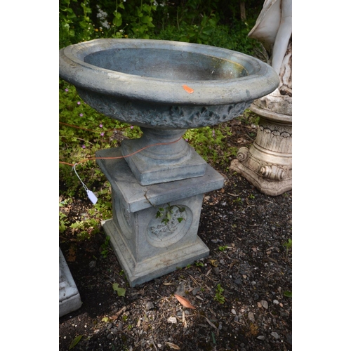 928 - A GREY COMPOSITE GARDEN URN, on a separate plinth, diameter 56cm x height 68cm x height of plinth 35... 