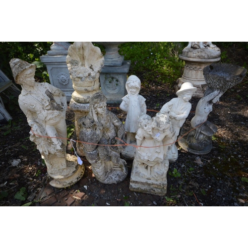 929 - SEVEN VARIOUS GARDEN FIGURES, to include males and females ornaments, one on a plinth