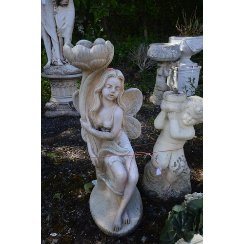 930 - A COMPOSTE URN STYLE WALL PLANTER, along with a figure of a fairy holding a flower and putto bird ba... 