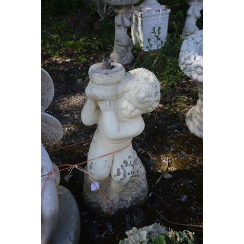 930 - A COMPOSTE URN STYLE WALL PLANTER, along with a figure of a fairy holding a flower and putto bird ba... 