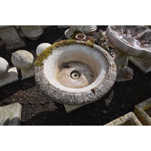 943 - A COMPOSITE GARDEN CAMPANA URN, on a separate base, stamped Sandford stone, diameter 61cm x height 5... 