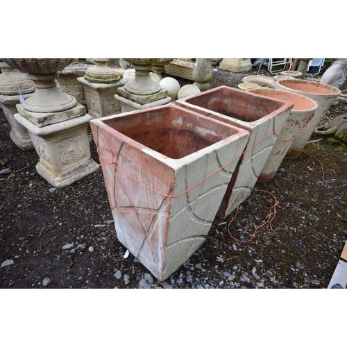 946 - A PAIR OF TAPERED SQUARE TERRACOTTA PLANTERS with a modern carved decoration, outer side later paint... 