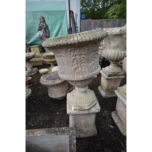 948 - A PAIR OF LARGE COMPOSITE FOLIATE DECORATED URNS with , on separate matched plinths with Art Nouveau... 