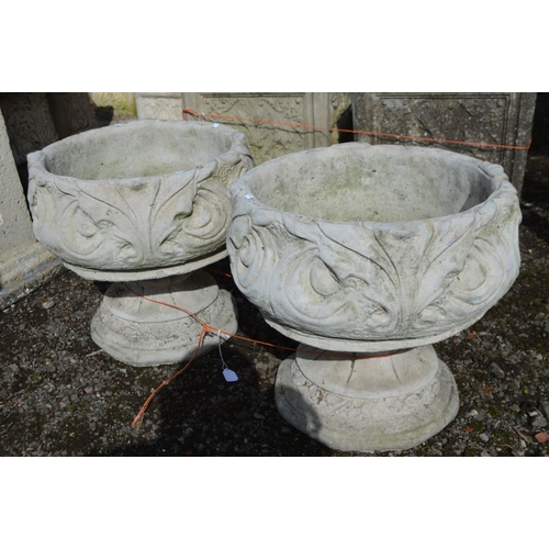 951 - A PAIR OF COMPOSITE FOLIATE GARDEN URNS, on separate bases, diameter 43cm x height 41cm