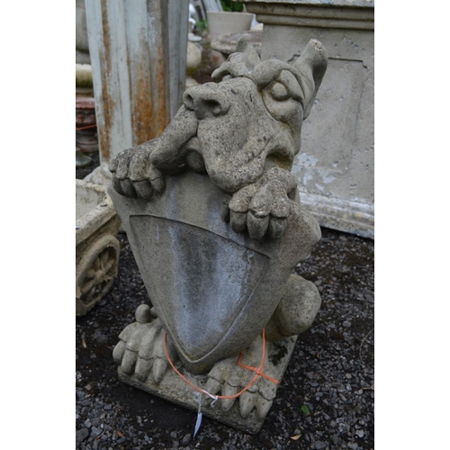 954 - A COMPOSITE GARDEN FIGURE of a hound holding a shield, along with a composite planter of a donkey an... 