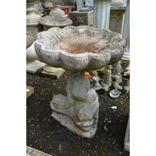 957 - A COMPOSITE SHELL SHAPED BIRD BATH on a mythical creature base, height 55cm (crack for top) along wi... 