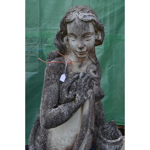 959 - A LARGE WEATHERED COMPOSITE GARDEN STATUE of a semi clad lady in flowing robes, holding a bowl, on a... 