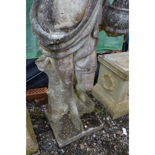 959 - A LARGE WEATHERED COMPOSITE GARDEN STATUE of a semi clad lady in flowing robes, holding a bowl, on a... 