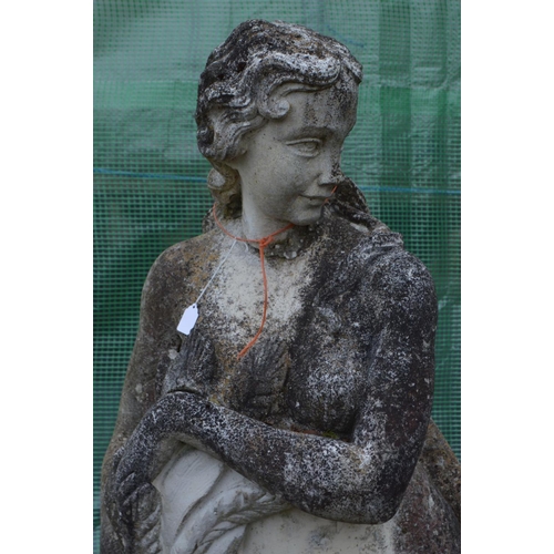 960 - A LARGE WEATHERED COMPOSITE GARDEN STATUE of a semi clad lady in flowing robes, collecting the crops... 