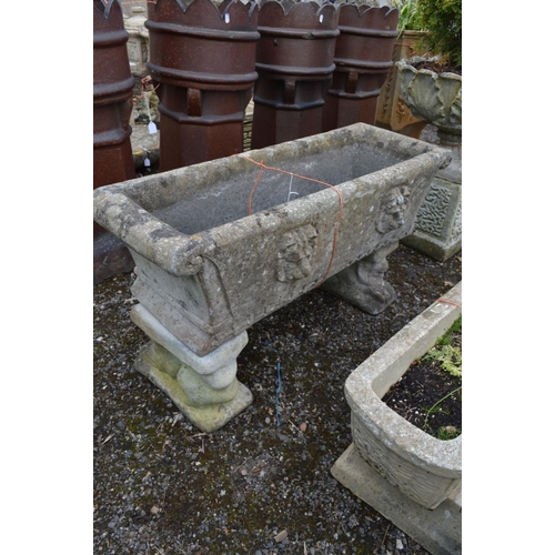 965 - A COMPOSITE RECTANGULAR PLANTER with scrolled ends, on matched twin supports, width 98cm x depth 40c... 