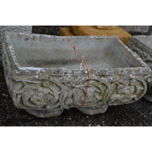 970 - A PAIR OF COMPOSITE RECTANGULAR PLANTERS, with foliate and putto decoration, width 56cm x depth 35cm... 