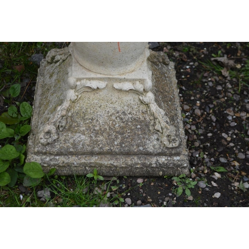 977 - A COMPOSITE CIRCULAR BIRD BATH on a separate pillar base with foliate decoration, diameter 50cm x he... 