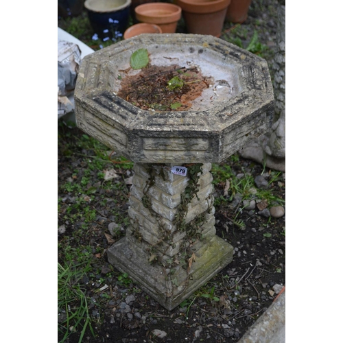 979 - A COMPOSITE OCTAGONAL BRICK EFFECT BIRD BATH, on a separate base, diameter 43cm x height 61cm (crack... 