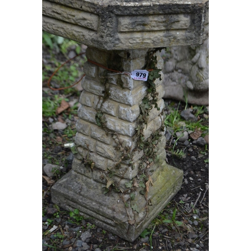 979 - A COMPOSITE OCTAGONAL BRICK EFFECT BIRD BATH, on a separate base, diameter 43cm x height 61cm (crack... 