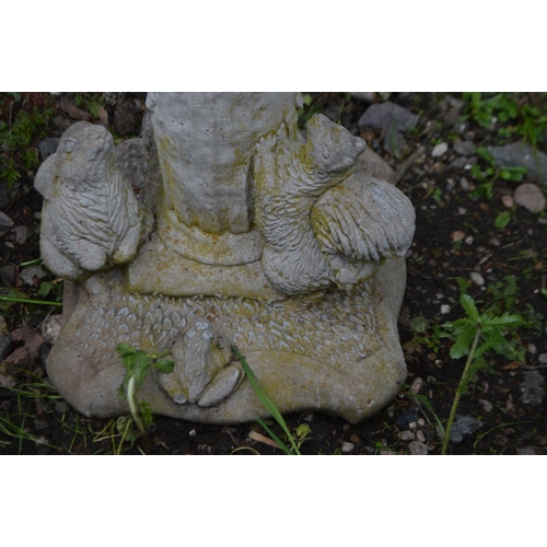 980 - A COMPOSITE GARDEN STATUE OF A FAUN PLAYING PAN PIPES, with two squirrels and poem to the base, heig... 