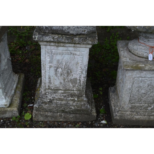 984 - A WEATHERED COMPOSITE GARDEN STATUE of a lady in flowing robes, on a separate matched plinth, later ... 