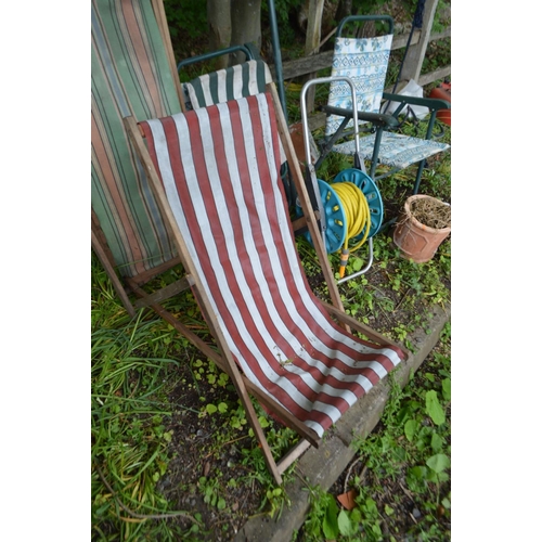 986 - TWO 1970'S STRIPPED TEAK SUN LOUNGERS (sd) along with two metal folding garden armchairs, parasol, h... 