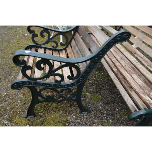 994 - A CAST IRON GREEN PAINTED GARDEN BENCH with teak slats, length 130cm and a matching armchair, length... 