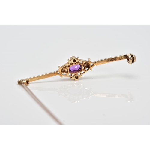 120 - A LATE 20TH CENTURY 9CT GOLD AMETHYST AND DIAMOND BROOCH, designed with a claw set, oval cut amethys... 