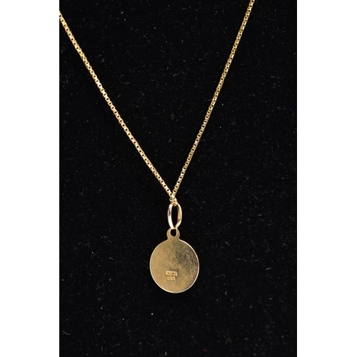 122 - A YELLOW METAL PENDANT NECKLACE, the pendant of a circular form with the zodiac lion sign 'Leo', app... 