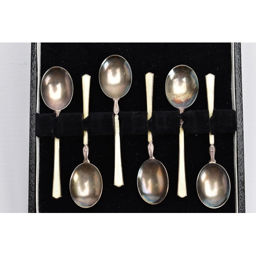 129 - A CASED SET OF SIX ELIZABETH II SILVER AND ENAMEL COFFEE SPOONS, the cream enamel decorated with flo... 