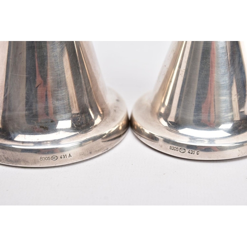 166 - TWO NORWEGIAN SILVER DOMED CANDLESTICKS, each of a plain polished design, on round weighted bases, t... 