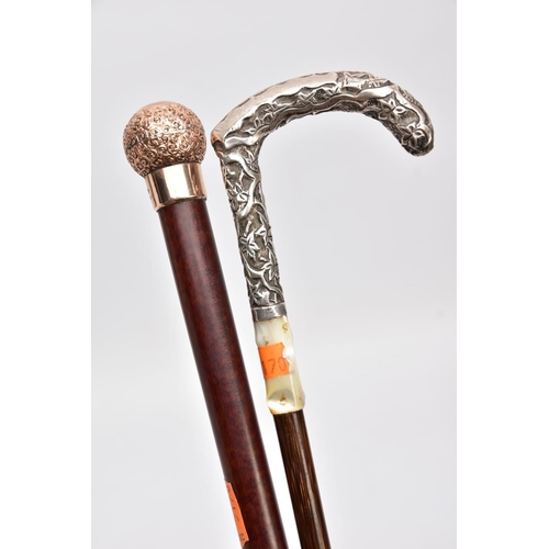 168 - TWO WALKING CANES, one set with a 9ct gold embossed foliate round handle with a vacant cartouche, ha... 