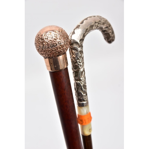 168 - TWO WALKING CANES, one set with a 9ct gold embossed foliate round handle with a vacant cartouche, ha... 