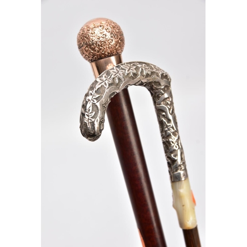 168 - TWO WALKING CANES, one set with a 9ct gold embossed foliate round handle with a vacant cartouche, ha... 