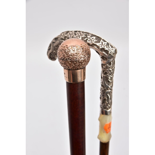 168 - TWO WALKING CANES, one set with a 9ct gold embossed foliate round handle with a vacant cartouche, ha... 