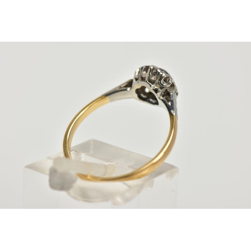 19 - A YELLOW METAL CLUSTER RING, designed with a central, circular cut blue sapphire within a surround o... 